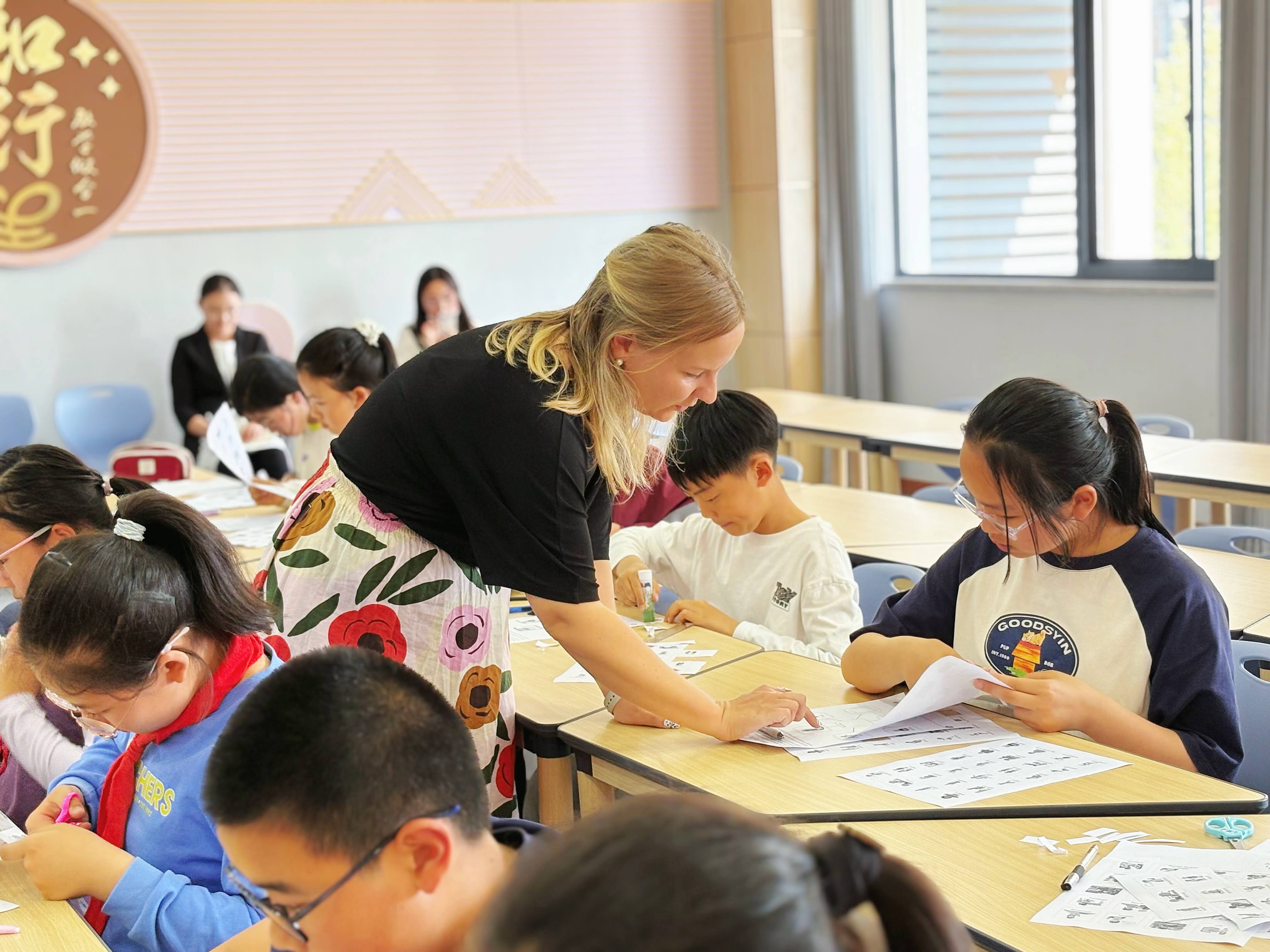 A Finnish teacher working with children in a classroom in China